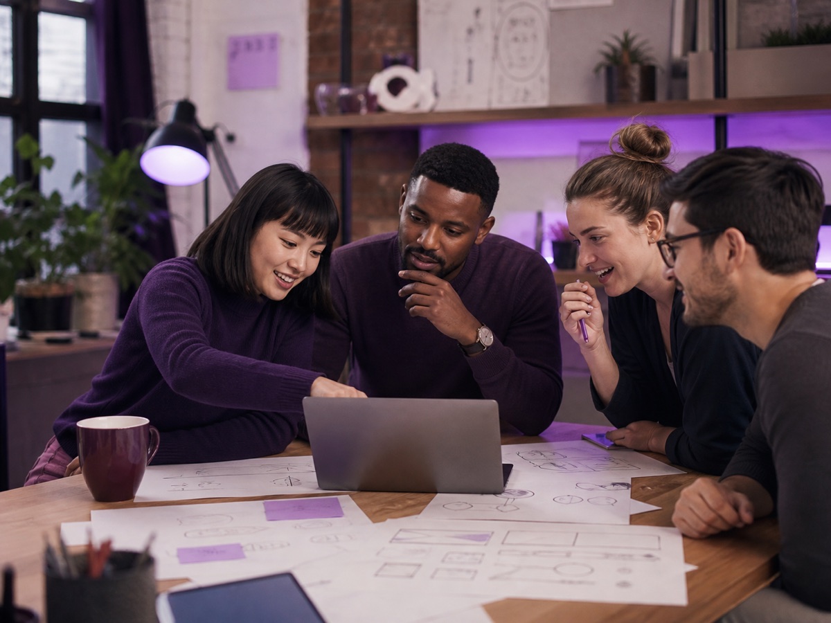 A diverse startup team collaborating on the Inder App experience