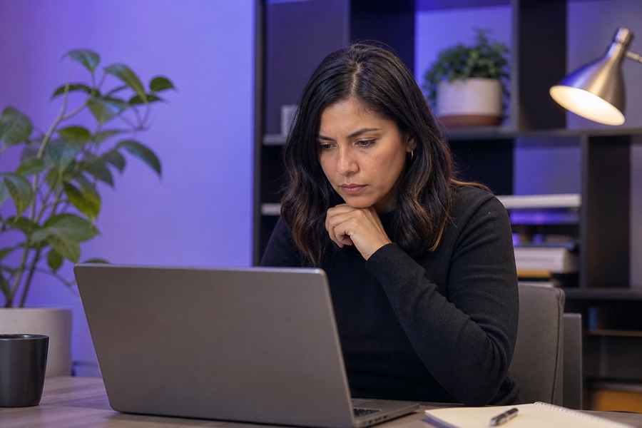 A human safety specialist carefully reviewing a report